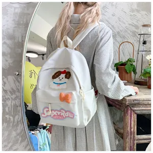 Japanese style cute student backpack with adorable puppy patch and sweet bow details for daily school.