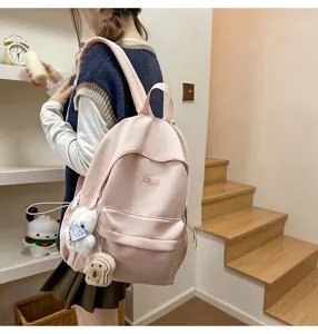 Pink casual campus backpack for women and students, lightweight stylish travel bookbag.