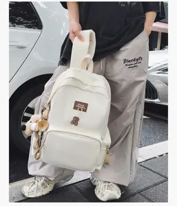 Large capacity casual solid color backpack for students daily commuting and school use.