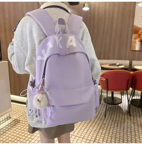 Detailed view of the casual purple backpack in a cafe setting, showing design features.