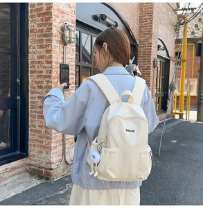 Casual waterproof school backpack for women, large capacity travel daypack for students.