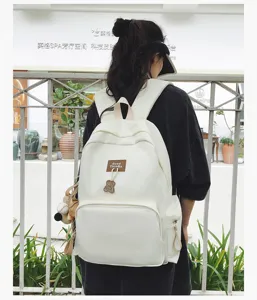 Canvas minimalist large capacity school backpack for students, solid white casual bookbag.