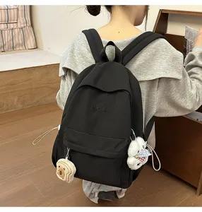 Casual nylon campus backpack for student daily travel, featuring cute plush toy pendants.