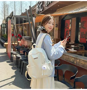 Lightweight waterproof travel backpack for women, large capacity student school bag.