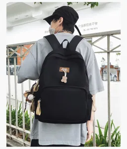 Minimalist large capacity student school backpack for men, solid color casual campus bag.
