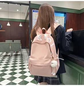 Large capacity pink canvas backpack for women, cute Japanese style casual school bag for daily use.