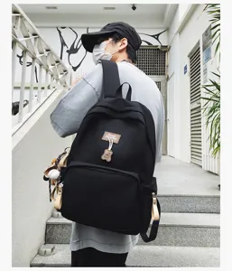 Detail view of the minimalist campus backpack with cute bear pendant and large capacity.