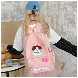 Cute pink canvas backpack for school girls, featuring cute puppy embroidery and bow.