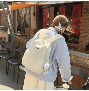 Casual white travel backpack for women, waterproof large capacity school bag for daily use.