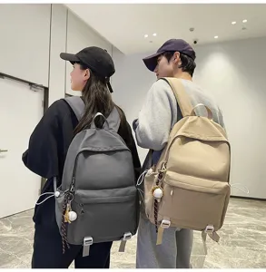 Versatile solid color casual school backpack for students, large capacity daypack for daily use.