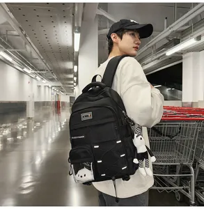 Stylish black multi-pocket school backpack for students, large capacity and lightweight design.