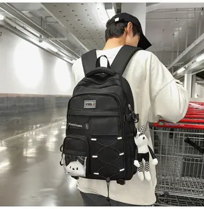 Large capacity school backpack for students, multi-pocket design with cute pendant.
