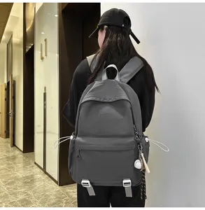 Minimalist solid color large capacity backpack for daily commuting and student use.