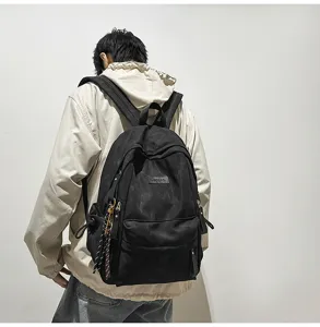 Casual minimalist canvas school backpack for students, large capacity black daypack.