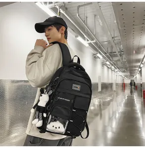 Large capacity school backpack for students, lightweight ergonomic design with cute plush pendant.