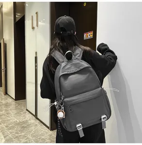 Detail view of a stylish grey casual backpack with large capacity for daily commute or school use.