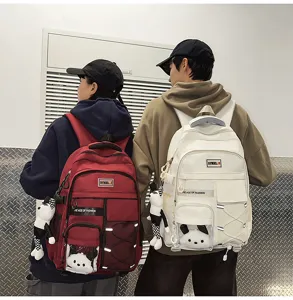Large capacity student backpack with cute panda pendant, comfortable spine protection school bag.