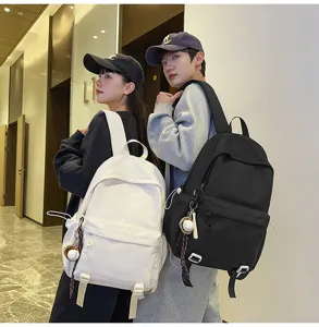 Detailed view of large capacity solid color school backpack for students, stylish and durable.