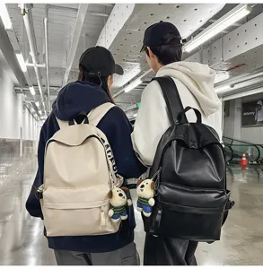 Detail view of minimalist PU leather waterproof backpack, casual stylish daypack for college students.