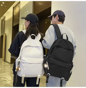 Large capacity solid color student backpack, versatile casual school bag for men and women.