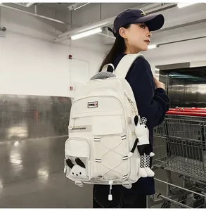 Large capacity student backpack with cute pendant, white lightweight school bag for youth.