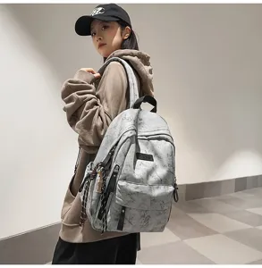 Casual grey canvas backpack for students, large capacity school bag with stylish design.