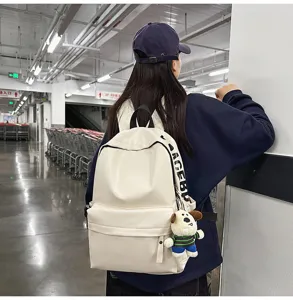 Minimalist white PU leather backpack for women, casual soft leather laptop school bag.