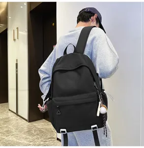 Black casual backpack with large capacity for men and students, perfect detail view.