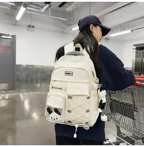 Casual multi-pocket canvas school backpack for students, large capacity beige book bag.