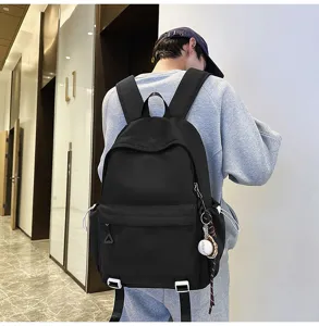Versatile black backpack for college students with large capacity solid color school bag
