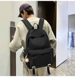 Classic black backpack for men and women, large capacity casual daypack for school.