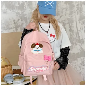 Cute Japanese style pink school backpack for girls with adorable dog embroidery and sweet bow.