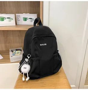 Waterproof casual school backpack for women and students, large capacity travel book bag.