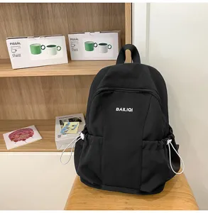 Casual black backpack for women and students with large capacity and multi-pocket storage daily use.