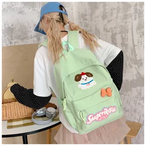 Japanese ins style cute canvas school backpack with embroidered dog patch and bow detail.