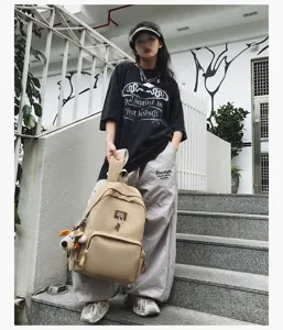 Casual large capacity campus backpack for students, stylish solid color schoolbag daily use.