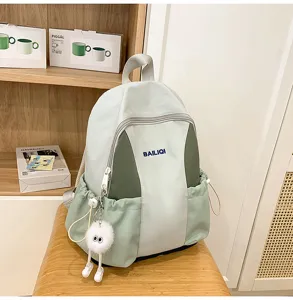 Stylish light green school backpack for daily commute and travel with cute plush pendant.