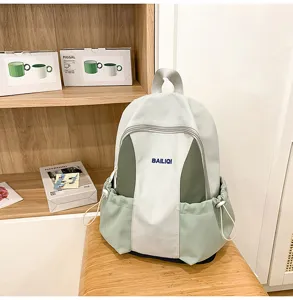 Light green waterproof backpack for women, stylish hiking school bag with multi pockets.