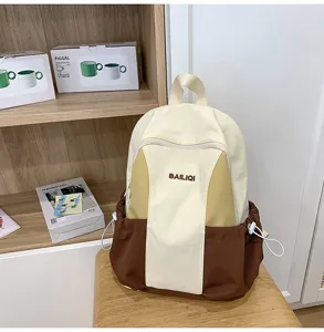Stylish casual canvas backpack with color block design, large capacity for daily school or travel use.