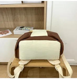 Casual color block backpack for daily travel, school, and outdoor activities with straps.