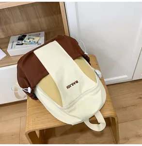 Casual color block backpack for daily travel, spacious canvas school bag for students.