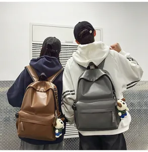 Waterproof PU leather backpack for college students, simple casual couple school bag.