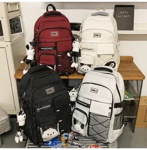 Large capacity student backpack with multiple compartments, trendy design, front mesh pocket.