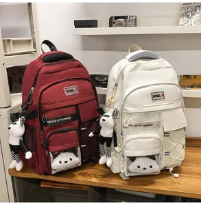 Large capacity student school backpack with cute pendant, lightweight spine protection
