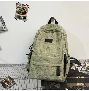 Detailed view of the Japanese vintage canvas school backpack with multiple pockets and straps.