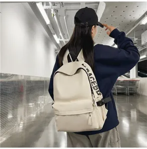 Minimalist PU leather waterproof backpack for women, stylish casual school bag, beige color.