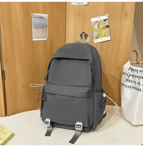 Versatile dark grey school backpack for students, large capacity solid color casual daypack.