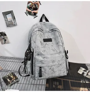 Minimalist gray tie-dye backpack detail, campus style schoolbag with front pocket and straps.