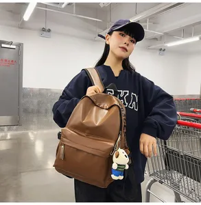 Stylish brown PU leather waterproof backpack for women, casual daily school student bookbag.