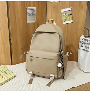 Beige casual backpack large capacity school bag with multiple pockets and cute pendant decor